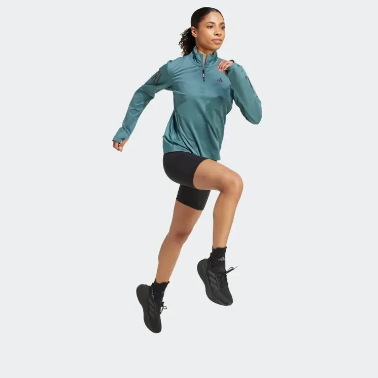 VESTE DEMI-ZIP OWN THE RUN FEMME